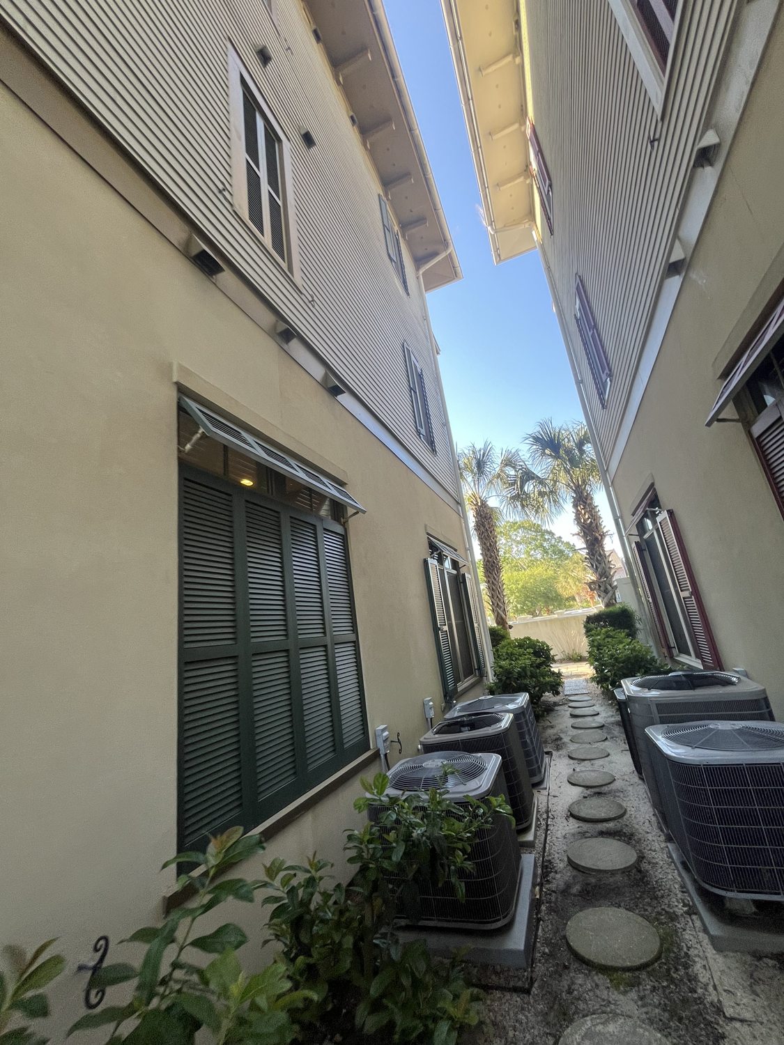 Clean building exteriors and walkway between units at a Lowcountry multi-unit property